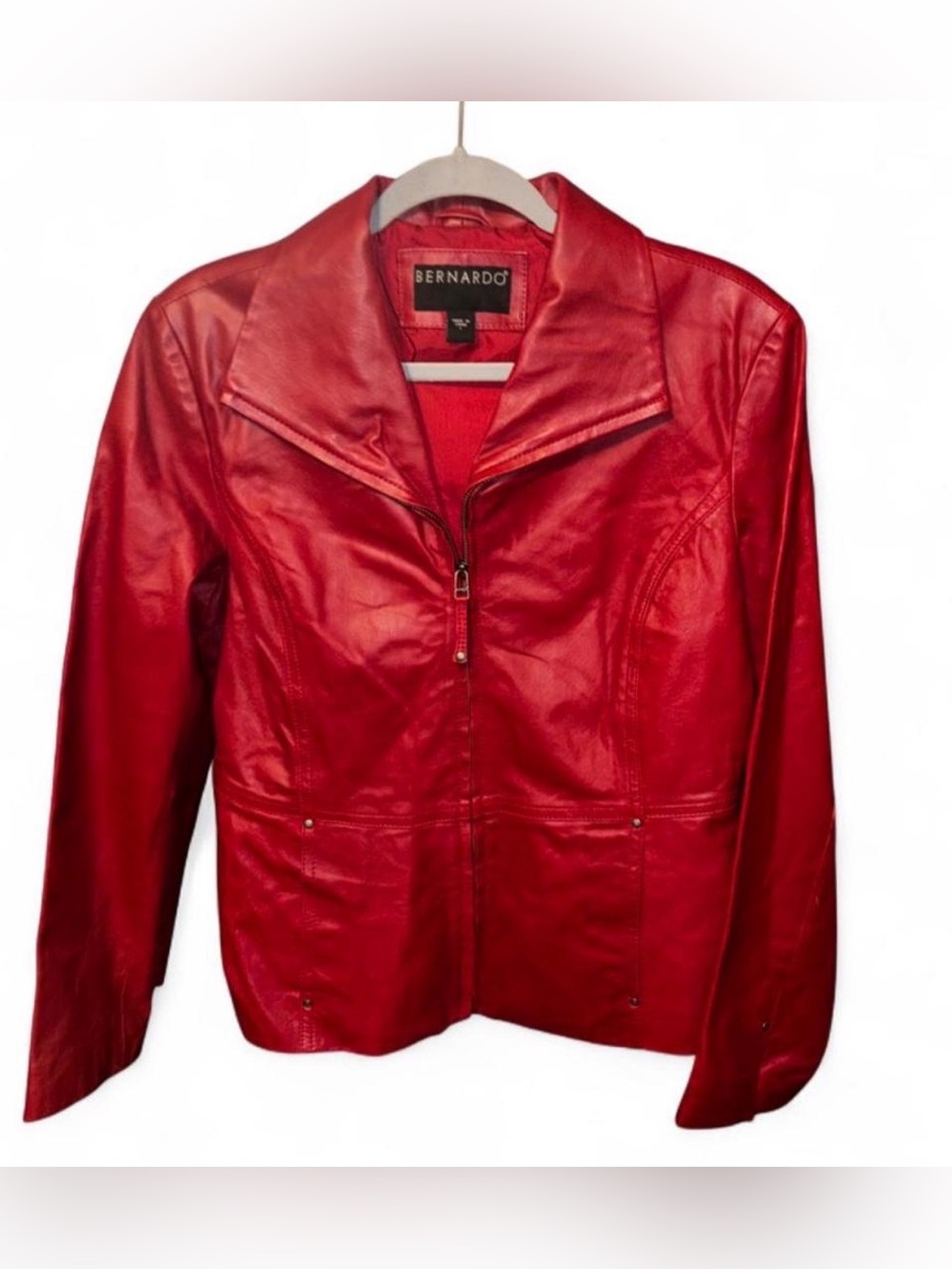 Bernardo red leather jacket with zipper closure and pockets.